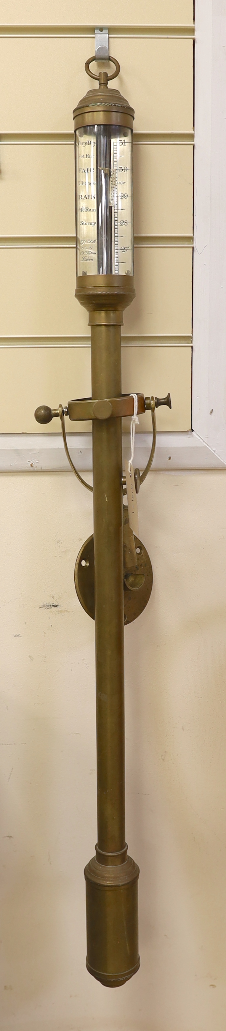 An early twentieth century marine barometer with a brass body mounted on a gimbal by R.N. Desterre, Lisbon, 93cm